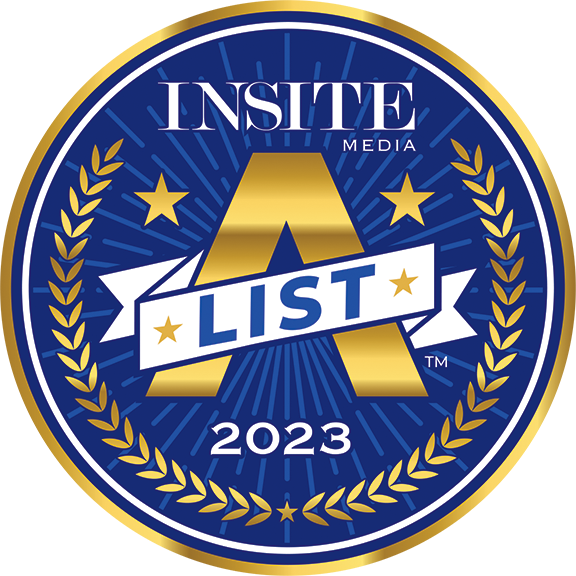 Circular badge with gold laurel leaves, stars, a large A and ribbon reading List, labeled Insite Media 2023 on a blue background.