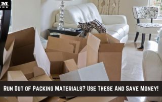 Open cardboard boxes and packing materials scattered in a bright, modern living room with furniture in the background. Text overlay: Run Out of Packing Materials? Use These And Save Money!.